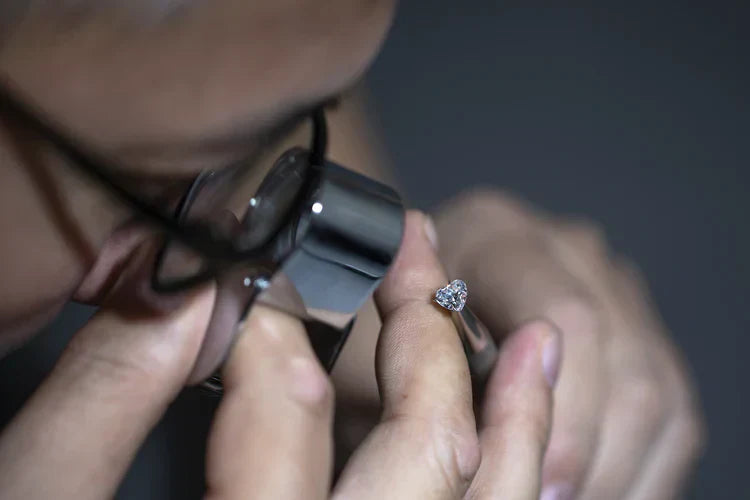 A Jeweler Inspecting diamond ring